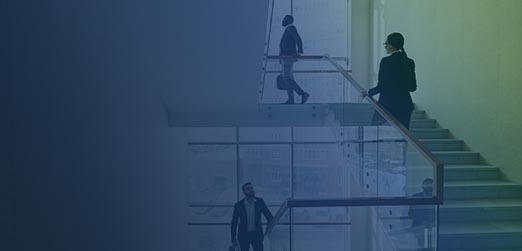 three people walking up office stairs