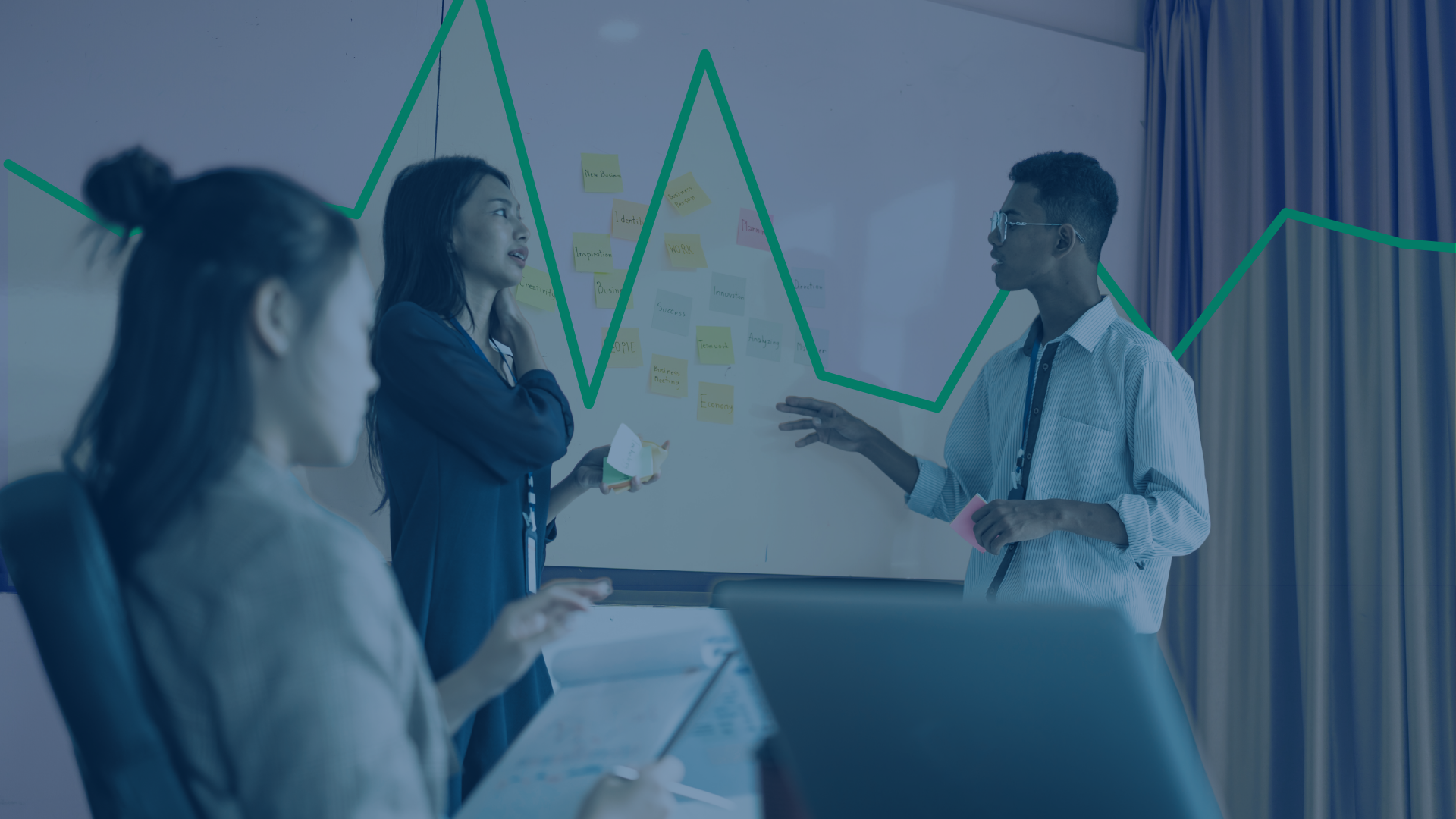 A team discussing revenue in a conference room